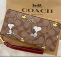 Women's Long Zip-Around Wallet – Khaki Signature Canvas with Snoopy & Woodstock Print  COACH x Peanuts CE705